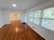 Open living area with gleaming hardwood floors and views of the front gazebo at 2225 Harold Se Ln, Smyrna, GA 30080