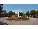 Smyrna Market Village entrance with landscaped flowerbeds and a tiered fountain at 2225 Harold Se Ln, Smyrna, GA 30080