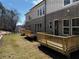 Townhouse backyard showcasing a wood deck and newly installed lawn at 235 W Marietta St, Canton, GA 30114