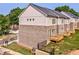 Townhouse backyard showcasing a wood deck and newly installed lawn at 235 W Marietta St, Canton, GA 30114