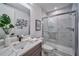 Modern bathroom with marble countertops, sleek fixtures, and a glass-enclosed shower for a luxurious feel at 235 W Marietta St, Canton, GA 30114