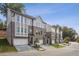 Attractive townhouses featuring a brick facade, multi-pane windows, and two-car garages at 235 W Marietta St, Canton, GA 30114