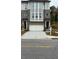 Charming townhouse with a two-car garage and a well-maintained front yard at 235 W Marietta St, Canton, GA 30114