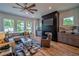 Bright and airy living room with hardwood floors, fireplace, and ample natural light at 235 W Marietta St, Canton, GA 30114