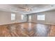 Spacious living room featuring stunning wood floors, neutral walls, and ample natural light at 3706 Bouldercrest Rd, Ellenwood, GA 30294