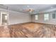 Open-concept living area featuring beautiful floors, recessed lighting, and fresh paint at 3706 Bouldercrest Rd, Ellenwood, GA 30294