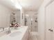 Bright bathroom featuring double sinks, cabinets, new fixtures, and a stand up shower at 4175 Spring Valley Cir, Tucker, GA 30084