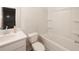 Bathroom featuring a tub/shower combo and a white vanity at 4175 Spring Valley Cir, Tucker, GA 30084