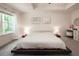Bedroom with a platform bed, large window, and a modern decor at 4175 Spring Valley Cir, Tucker, GA 30084