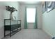 Bedroom featuring a neutral color palette, a large window with lots of natural light, and carpeted floors at 4175 Spring Valley Cir, Tucker, GA 30084