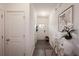 Inviting hallway with modern decor, stylish lighting, and wood-look floors at 4175 Spring Valley Cir, Tucker, GA 30084