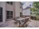 Back deck with table, chairs and grill, a perfect place for entertaining at 7071 Glen Cove Ln, Stone Mountain, GA 30087