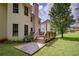 Spacious backyard with deck, concrete patio, and manicured lawn at 7071 Glen Cove Ln, Stone Mountain, GA 30087