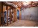 Unfinished basement space with exposed framing and concrete walls at 7071 Glen Cove Ln, Stone Mountain, GA 30087