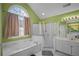 Bathroom with tub, separate shower and dual sinks at 7071 Glen Cove Ln, Stone Mountain, GA 30087