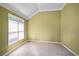 Clean, basic bedroom with window and wall-to-wall carpeting at 7071 Glen Cove Ln, Stone Mountain, GA 30087
