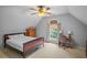 Cozy bedroom with carpeted floors, a window, ceiling fan, and desk at 7071 Glen Cove Ln, Stone Mountain, GA 30087