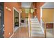 Inviting foyer with staircase, hardwood floors, and natural light that welcomes guests at 7071 Glen Cove Ln, Stone Mountain, GA 30087