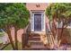 Charming brick home exterior with meticulously maintained landscaping leading to the front door at 7071 Glen Cove Ln, Stone Mountain, GA 30087