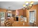 Charming kitchen with island, breakfast table, stainless steel appliances, and ample counter space at 7071 Glen Cove Ln, Stone Mountain, GA 30087