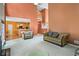 Open-concept living room boasting soaring ceilings, neutral walls, and lots of natural light at 7071 Glen Cove Ln, Stone Mountain, GA 30087