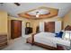 Comfortable main bedroom with walk-in closet, ceiling fan, and bedside table at 7071 Glen Cove Ln, Stone Mountain, GA 30087
