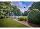 Well-maintained community tennis courts with seating at 7071 Glen Cove Ln, Stone Mountain, GA 30087
