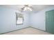 Bedroom with a window and green door with carpet at 735 Wood Valley Trce, Roswell, GA 30076