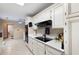 Well-maintained kitchen with white cabinets and modern appliances at 735 Wood Valley Trce, Roswell, GA 30076