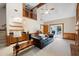Inviting living room featuring wet bar, comfortable seating, and access to the outdoors at 735 Wood Valley Trce, Roswell, GA 30076