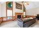 Grand living room with high ceilings, fireplace, and large windows for natural light at 735 Wood Valley Trce, Roswell, GA 30076