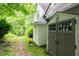 Backyard with outdoor storage shed, offering practical solutions for garden equipment and tools at 735 Wood Valley Trce, Roswell, GA 30076