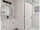 Elegant bathroom featuring a white vanity, modern fixtures and natural light at 819 Humphries St, Atlanta, GA 30310