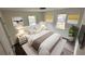Cozy bedroom with plush bedding, modern décor, and bright natural light at 819 Humphries St, Atlanta, GA 30310