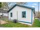 This home has white siding, blue trim, fenced yard, and an air conditioning unit at 819 Humphries St, Atlanta, GA 30310