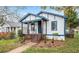 Inviting home with landscaped yard and charming front porch at 819 Humphries St, Atlanta, GA 30310