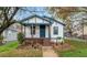 Charming home with a welcoming front porch and beautifully landscaped front yard at 819 Humphries St, Atlanta, GA 30310