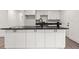 Modern kitchen island with sleek black countertop and ample storage space at 819 Humphries St, Atlanta, GA 30310