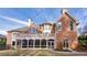 Large backyard featuring a covered porch and deck, providing ample space for relaxation and entertainment at 2760 Sugarloaf Club Dr, Duluth, GA 30097