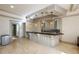 The bar area features custom cabinetry, pendant lights, and ample counter space at 2760 Sugarloaf Club Dr, Duluth, GA 30097