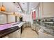 Home bar with marble countertops, pendant lighting, cabinets, and tile floors at 2760 Sugarloaf Club Dr, Duluth, GA 30097