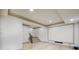 Finished basement features a large media screen, neutral color palette, and tiled floors at 2760 Sugarloaf Club Dr, Duluth, GA 30097