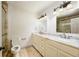 Bright bathroom featuring dual sinks with marble countertops and a glass door shower at 2760 Sugarloaf Club Dr, Duluth, GA 30097