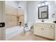Cozy bathroom featuring tile walls, a vanity, and a toilet at 2760 Sugarloaf Club Dr, Duluth, GA 30097