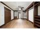 Bedroom features a built-in shelving unit, a ceiling fan, and a view into another room at 2760 Sugarloaf Club Dr, Duluth, GA 30097