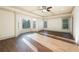 Light-filled bedroom with large bay windows, and hardwood flooring at 2760 Sugarloaf Club Dr, Duluth, GA 30097