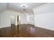 Bonus room with hardwood floors, large window with shutters, and a walk in closet at 2760 Sugarloaf Club Dr, Duluth, GA 30097