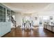 View of light-filled breakfast nook with hardwood floors and a staircase in an open floor plan at 2760 Sugarloaf Club Dr, Duluth, GA 30097