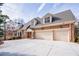 Spacious three-car garage with a wide driveway, offering ample parking and convenience at 2760 Sugarloaf Club Dr, Duluth, GA 30097