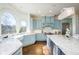 Spacious kitchen features a large center island, granite countertops, stainless steel appliances, and hardwood floors at 2760 Sugarloaf Club Dr, Duluth, GA 30097